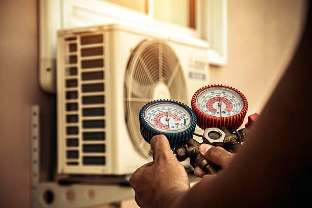 Professional Air Conditioning Service technician working in Sheldonville, MA